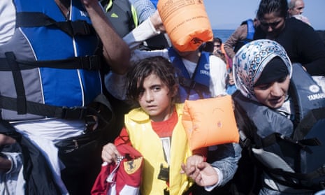 Refugees arrive on  Sykamias beach, west of the port city of Mytilene.