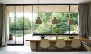 A glass wall to the veranda in the living room and the dinning table made by Claire’s father.