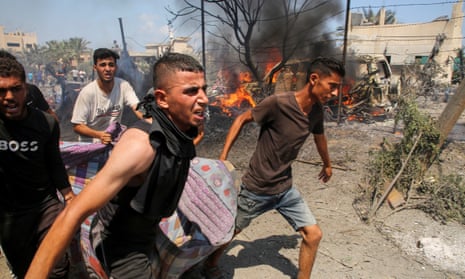 Palestinians carry someone on a makeshift stretcher