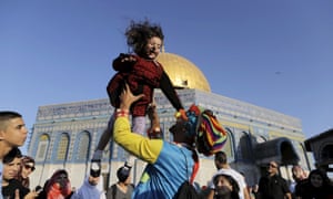 Old City, Jerusalem
A young girl is thrown in to the air during celebrations near the Dome of the Rock