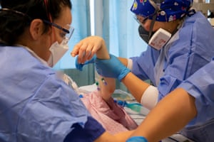 Medical staff serve patients in intensive care