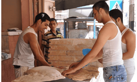 A 2010 photograph of Saj griddle bread, used as a base for chicken fatta, being made on the streets of the Rimal neighborhood of Gaza City.
