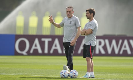 South Korea’s head coach Paulo Bento, left, talks with assistant coach Sergio Costa. Bento is suspended from the bench for Friday’s match following his red card against Ghana.