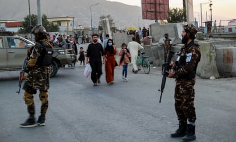 Taliban guards near scene of blast