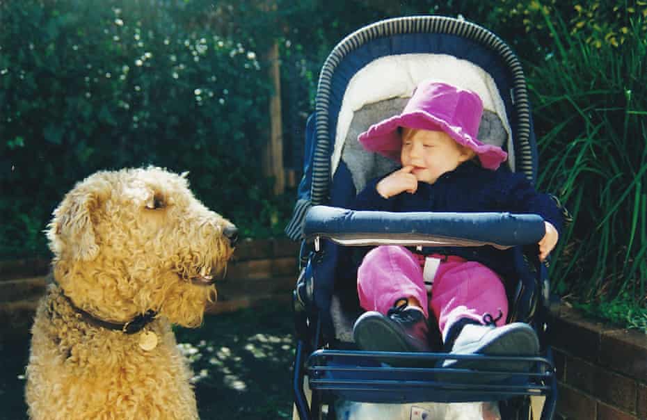 Maddie as a toddler with family dog Tess.