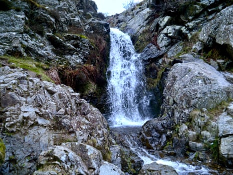 Water from the bogs plunges over the rock face creating the Light Spout waterfall.