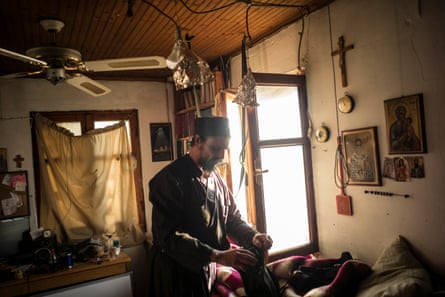 Father Iusif inside his bedroom at his cell in Karoulia.
