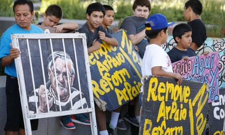People protest against former sheriff Joe Arpaio in front of the Maricopa county sheriff’s office in Phoenix, 25 May 2016.