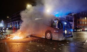 Police clear the streets of The Hague as riots erupt amid new Covid restrictions