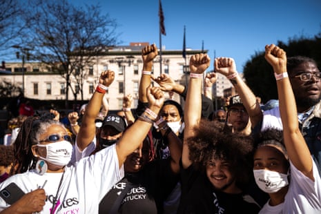Black Lives Matter protesters display their I VOTED wristbands after early voting on 13 October 2020 in Louisville, Kentucky. 