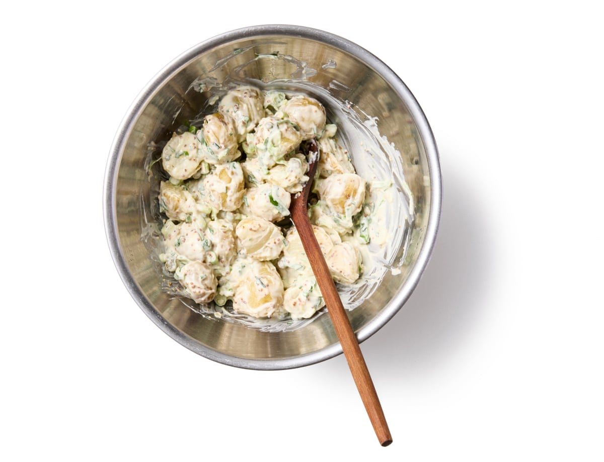 Felicity Cloake’s potato salad 09a. Before serving, drain off any remaining vinaigrette from the cooled potatoes (you can save and reuse it on a plate of tomatoes or a green salad) and, then mix the potatoes with just enough mayonnaise to coat.