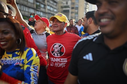 A supporter of Venezuelan president Nicolás Maduro wearing a T-shirt bearing an image of Donald Trump and the slogan ‘Yankee go home’