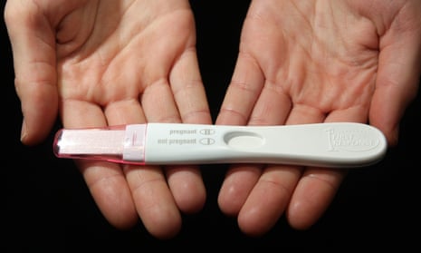 Person holding a pregnancy test