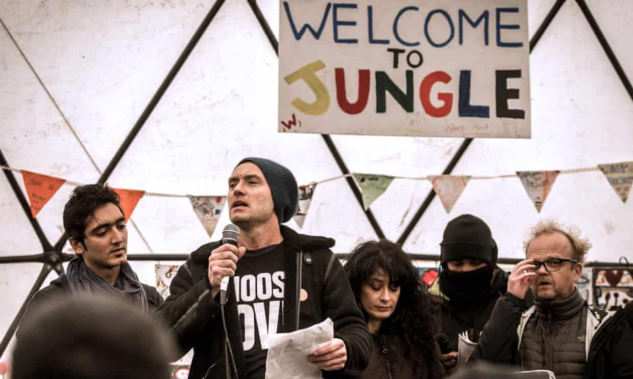 Jude Law (centre) speaks during a visit to the ‘Jungle’ migrant camp in Calais on 21 February to draw attention to the plight of refugees facing imminent eviction.