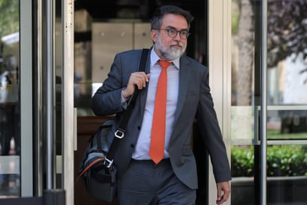 a man walking out of a door