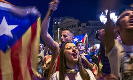 Catalans join a protest in Barcelona on Saturday night.