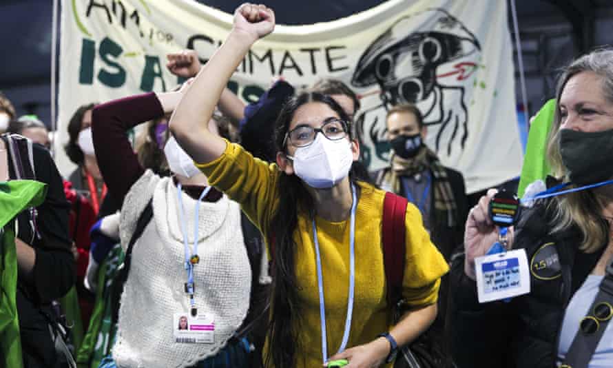 Climate activists and delegates stage a walkout in protest of the ongoing negotiation on day 13 of the Cop26 climate talks in Glasgow, Scotland.