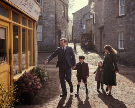 A family walk down a cobbled street in an old Yorkshire town.