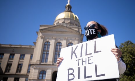 Opponents of Republican backed bills accused of purporting voter suppression, hold a protest outside the Georgia state capitol building on Monday.