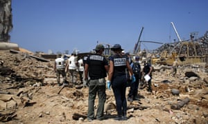 Investigators at the scene of the 4 August explosion in Beirut docks.