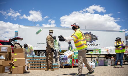 The Navajo Nation president, Jonathan Nez, helps distribute supplies to Navajo families on the Navajo Nation in May.