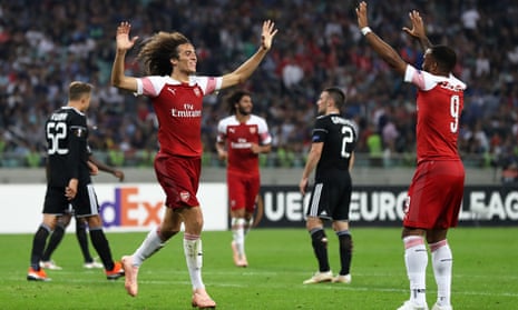 Matteo Guendouzi of Arsenal celebrates with teammate Alexandre Lacazette after scoring his team’s third goal.