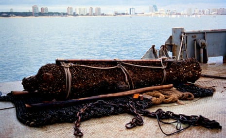 A rusted cannon lying on a deck