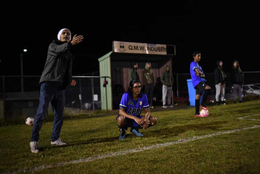 Muhammed Ebarahim, a former refugee and member of QR The Brave FC, watches his team.