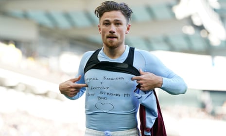 Aston Villa’s Matty Cash celebrates scoring their side’s first goal of the game, and reveals a t-shirt supporting Poland team-mate Tomasz Kedziora.