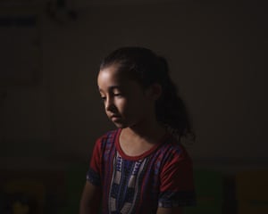 Maya Abu Muawad, eight, at a school run by the UN where her family is taking shelter after their home was destroyed during an 11-day war in northern Gaza Strip. After Israeli airstrikes on the family’s home, Maya was separated from her mother. Alone and afraid, she rode in an ambulance to safer ground. For 15 minutes, she was locked in the wailing vehicle with a dying person and a wounded boy, her neighbour