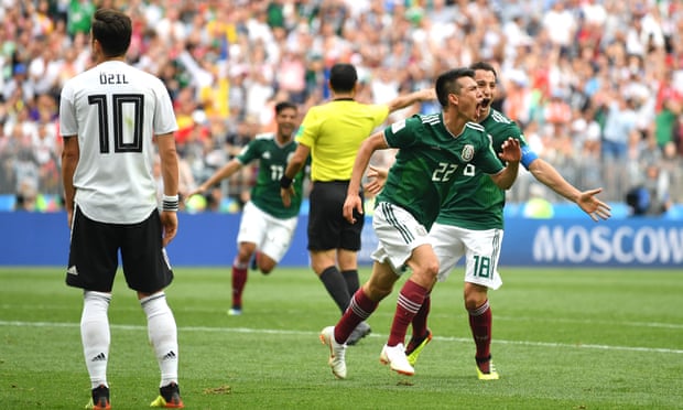 Hirving Lozano (No 22) celebrates his first-half winner for Germany as Mesut Özil looks dejected.