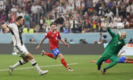Costa Rica’s keeper Keylor Navas (right) saves a shot from Niclas Füllkrug (left) of Germany
