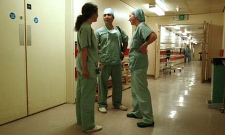 NHS junior doctors talking  in a corridor of the Whittington hospital in London