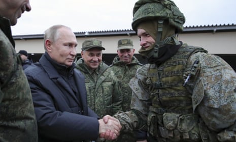 Russian president Vladimir Putin shakes hands with a soldier at a military training centre in Ryazan, Russia.