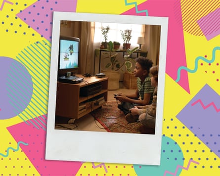An old photo of two young boys sitting on a living room floor playing video games