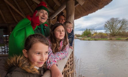Children on a tour around Carmarthenshire Wetland Centre, accompanied by an elf.