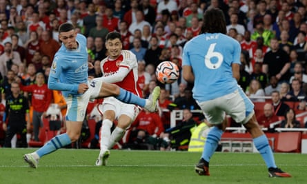 8 October 2023 Gabriel Martinelli shoots and the ball deflects off Nathan Aké to give Arsenal victory against Manchester City at the Emirates Stadium.