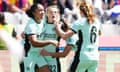 Erin Cuthbert (centre) is congratulated by her teammates after giving Chelsea a 1-0 lead against Barcelona.