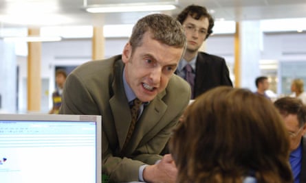 Peter Capaldi’s angry face leaning towards someone in an office, in a scene from The Thick of it.