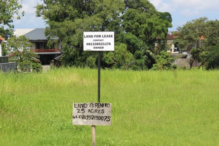 Rice field with land for lease sign