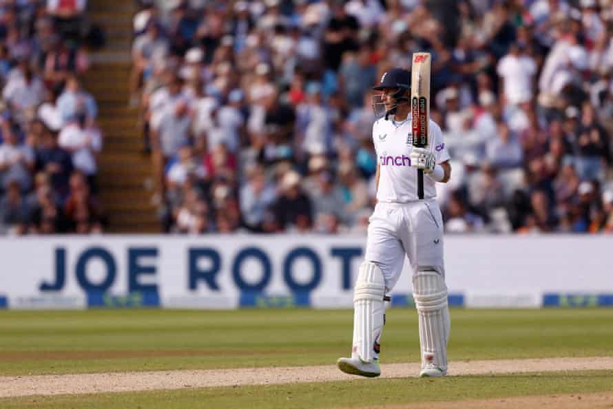 England’s Joe Root celebrates reaching his half century.