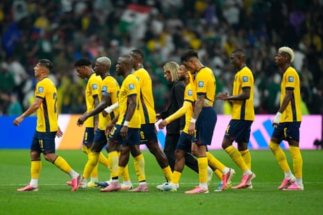 The Ecuador players leave the field with head coach Sebastian Beccacece