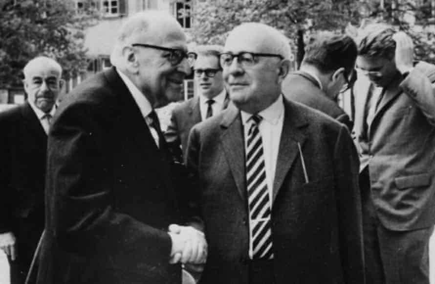 Heidelberg, 1964: Horkheimer, left, shakes hands with Adorno, as Habermas runs his hand through his hair in the background.