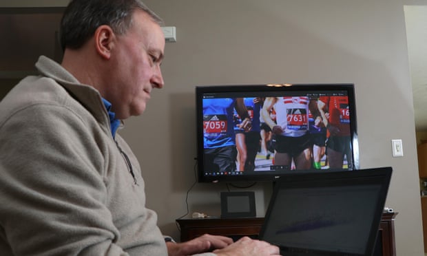 He’s got your number: Derek Murphy looks at a graph of runner start and finish times as he works at his Marathon Investigations business at his home in Ohio.