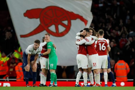 Arsenal celebrate at the whistle.
