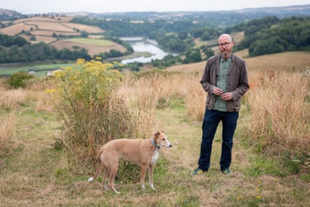 Rupert Callender with his lurcher, Peaches, at the burial site above the River Dart