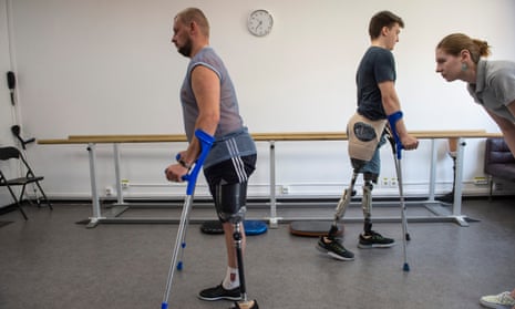 Patients practise with their new prosthetic limbs.