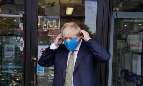 Boris Johnson wears a face mask while campaigning in his Uxbridge constituency.
