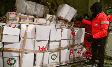 Boxes of rescue aid delivered by an Iraqi air force plane at Damascus airport