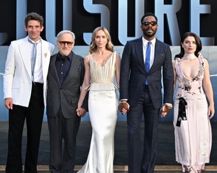 two women and three men on red carpet